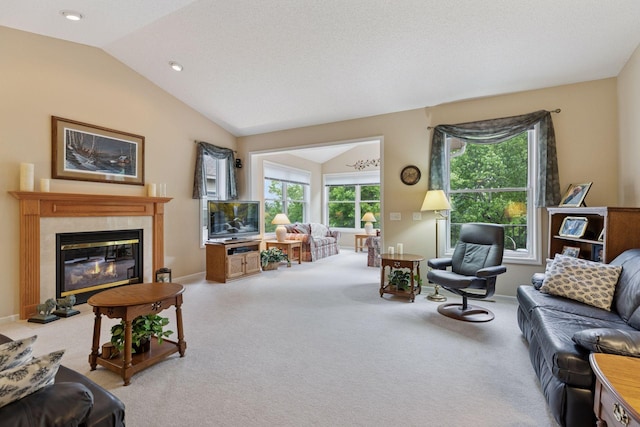 17462 Haralson Dr, Eden Prairie, MN 55347 - carpeted living room featuring vaulted ceiling and a tiled fireplace
