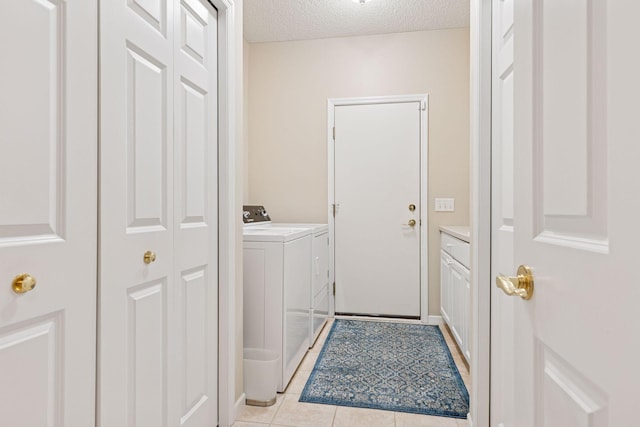 17462 Haralson Dr, Eden Prairie, MN 55347 - laundry room featuring separate washer and dryer, a textured ceiling, and light tile patterned floors