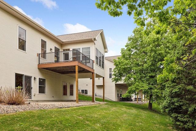 17462 Haralson Dr, Eden Prairie, MN 55347 - rear view of property featuring a yard, roof with shingles, a wooden deck, and a patio