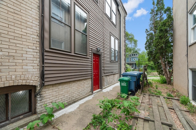 822 35th St, Minneapolis, MN 55408 - view of side of property featuring brick siding