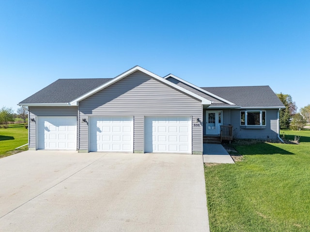 ranch-style house with an attached garage, driveway, a front lawn, and roof with shingles