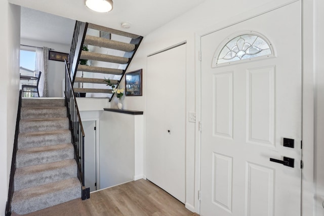 5624 Brookdale Dr N, Brooklyn Park, MN 55443 - staircase featuring wood finished floors