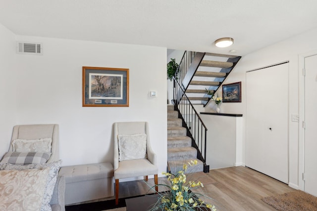 5624 Brookdale Dr N, Brooklyn Park, MN 55443 - unfurnished room with light wood-style flooring and stairs