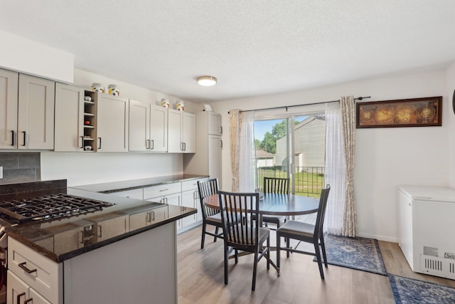 5624 Brookdale Dr N, Brooklyn Park, MN 55443 - dining room featuring light wood finished floors and a textured ceiling