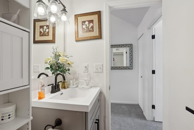 5624 Brookdale Dr N, Brooklyn Park, MN 55443 - bathroom with vanity, vaulted ceiling, and a chandelier