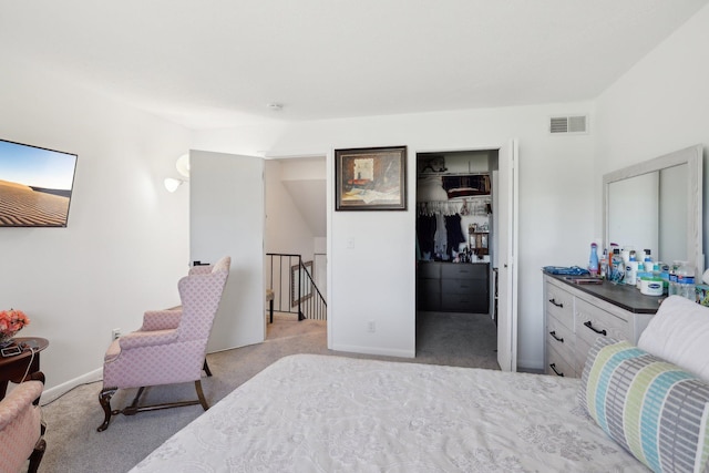 5624 Brookdale Dr N, Brooklyn Park, MN 55443 - bedroom featuring carpet flooring, a walk in closet, a closet, and baseboards