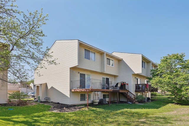 5624 Brookdale Dr N, Brooklyn Park, MN 55443 - rear view of house featuring stairway, a deck, a yard, and central AC unit