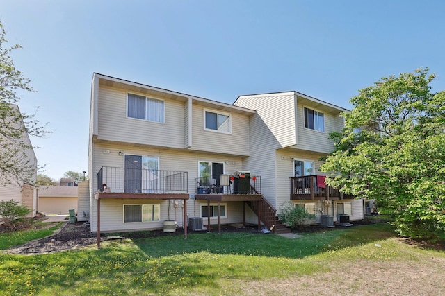 5624 Brookdale Dr N, Brooklyn Park, MN 55443 - rear view of property with cooling unit, stairs, a deck, and a yard