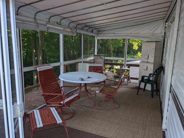 2221 Reubens Ln SW Unit 46, Farwell, MN 56327 - sunroom with healthy amount of natural light and outdoor dining space