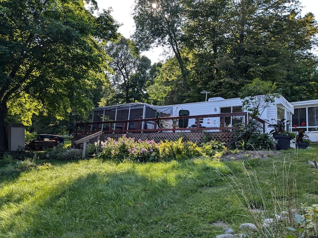 2221 Reubens Ln SW Unit 46, Farwell, MN 56327 - back of house with a sunroom and a deck