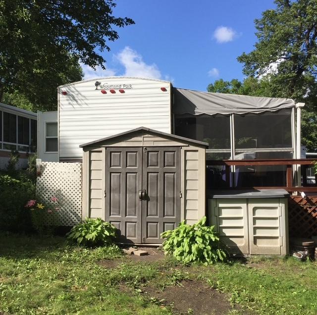 2221 Reubens Ln SW Unit 46, Farwell, MN 56327 - view of shed featuring a sunroom