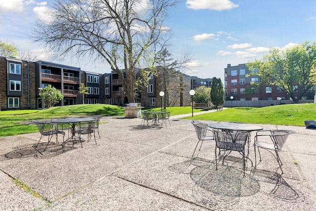 450 Ford Rd Unit 231, Saint Louis Park, MN 55426 - view of property's community featuring a lawn and outdoor dining space