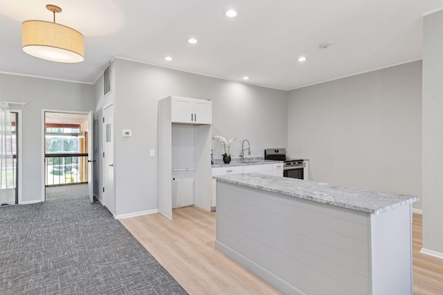 450 Ford Rd Unit 231, Saint Louis Park, MN 55426 - kitchen featuring stainless steel electric range oven, a sink, white cabinets, light wood-style flooring, and recessed lighting