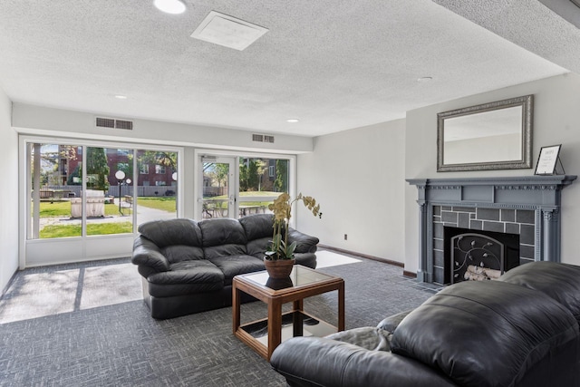 450 Ford Rd Unit 231, Saint Louis Park, MN 55426 - carpeted living room with plenty of natural light, a textured ceiling, a fireplace, baseboards, and recessed lighting