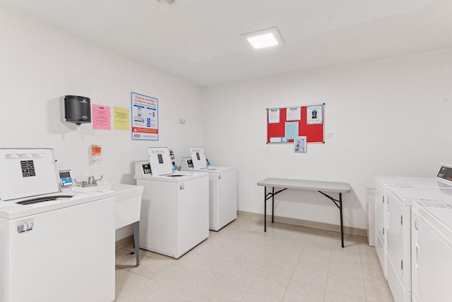450 Ford Rd Unit 231, Saint Louis Park, MN 55426 - community laundry featuring washer and dryer and baseboards