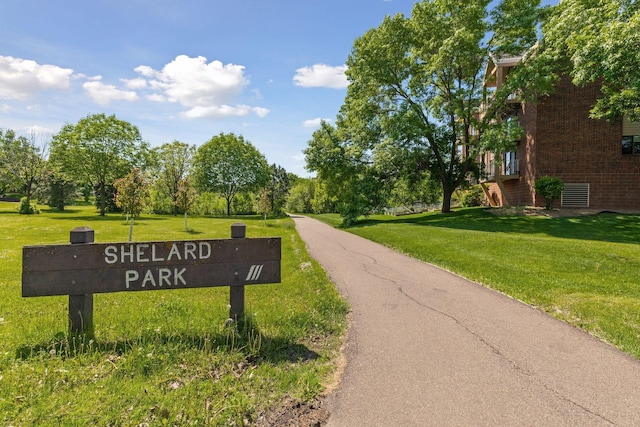 450 Ford Rd Unit 231, Saint Louis Park, MN 55426 - view of property's community featuring a yard and view of wooded area