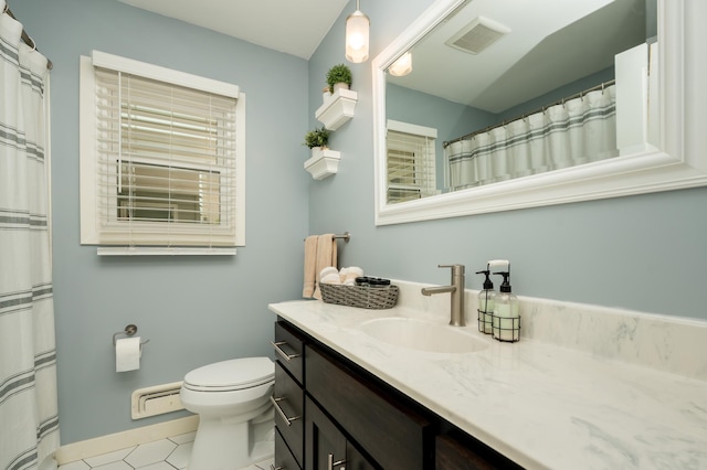 bathroom with toilet, vanity, and tile patterned flooring