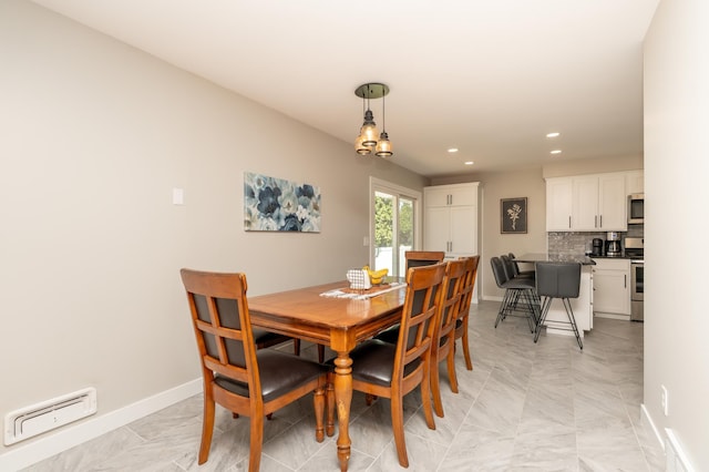 dining area with recessed lighting and baseboards