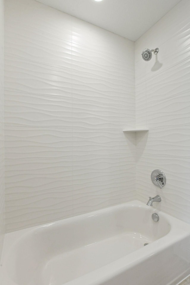 bathroom with washtub / shower combination