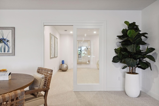 carpeted dining area featuring recessed lighting and baseboards