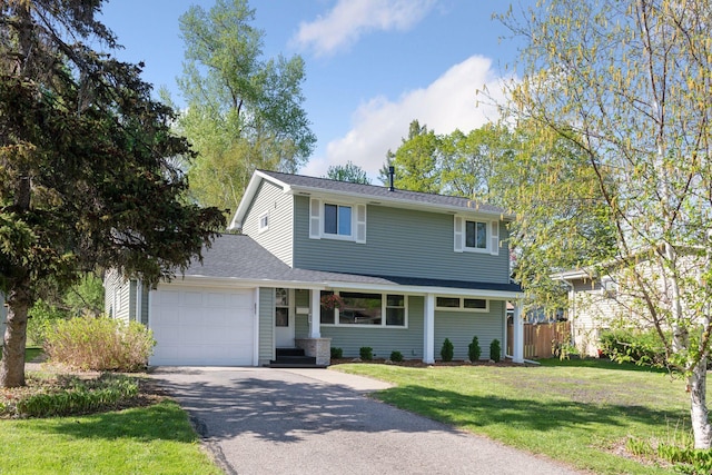 550 Wheeler Dr, Excelsior, MN 55331 - traditional home with a garage, driveway, and roof with shingles