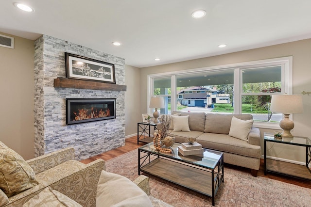 550 Wheeler Dr, Excelsior, MN 55331 - living area featuring wood finished floors, a fireplace, recessed lighting, and baseboards