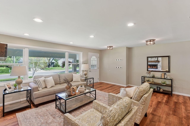550 Wheeler Dr, Excelsior, MN 55331 - living area with wood finished floors, baseboards, and recessed lighting