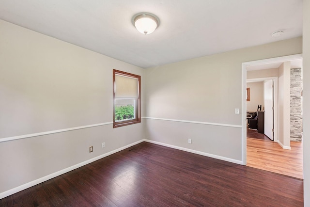 550 Wheeler Dr, Excelsior, MN 55331 - unfurnished room with wood finished floors, baseboards, and a smoke detector