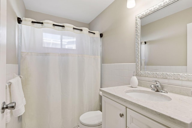 550 Wheeler Dr, Excelsior, MN 55331 - bathroom featuring tile walls, toilet, vanity, wainscoting, and a shower with shower curtain