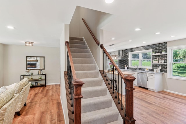 550 Wheeler Dr, Excelsior, MN 55331 - stairs with wood finished floors, recessed lighting, and baseboards