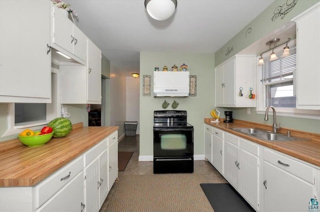 kitchen with black range with electric cooktop, a sink, under cabinet range hood, white cabinets, and light countertops