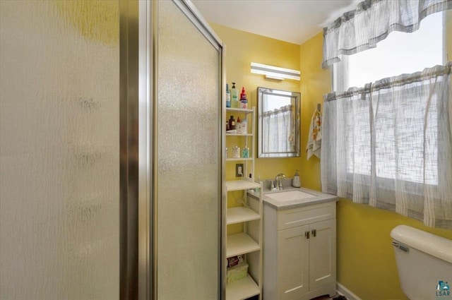 bathroom featuring toilet and vanity