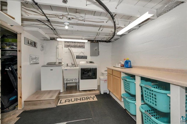 clothes washing area featuring separate washer and dryer and electric panel