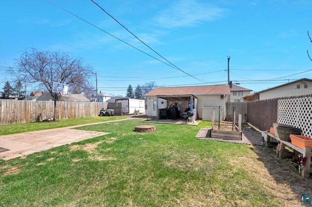 view of yard with a garden and a patio area