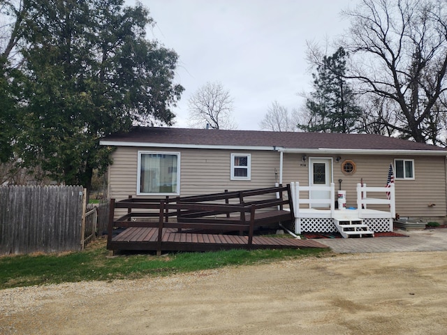 713 Home St, Kenyon, MN 55946 - view of front facade with a deck and fence