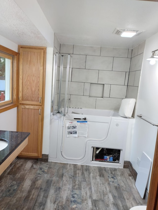 713 Home St, Kenyon, MN 55946 - washroom featuring dark wood-style floors
