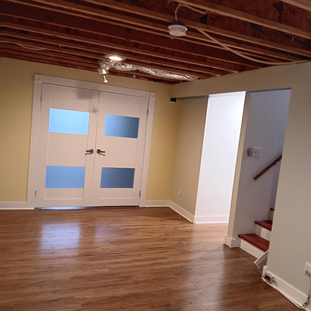 713 Home St, Kenyon, MN 55946 - entryway with dark wood finished floors, stairway, baseboards, and french doors