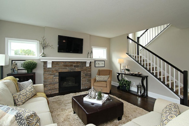 19587 Hammock Ave, Lakeville, MN 55044 - living area featuring healthy amount of natural light, wood finished floors, stairway, and baseboards