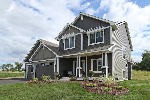 19587 Hammock Ave, Lakeville, MN 55044 - craftsman house with board and batten siding, a porch, a shingled roof, and a front yard