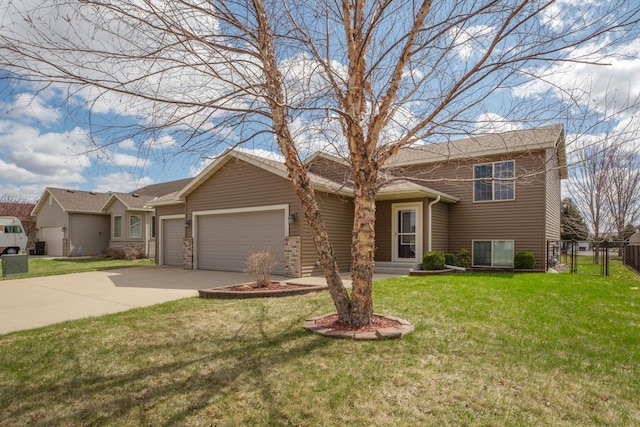view of front facade featuring an attached garage, concrete driveway, and a gate