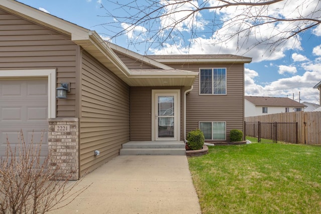 doorway to property with a garage