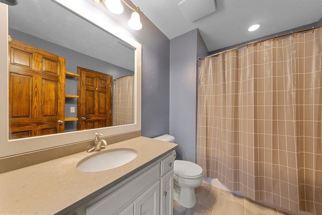 bathroom featuring toilet, a textured ceiling, vanity, and a shower with shower curtain