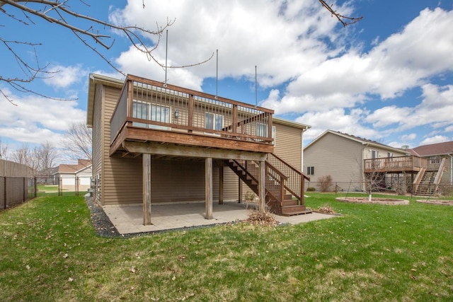 back of house featuring stairway, a patio, and a deck