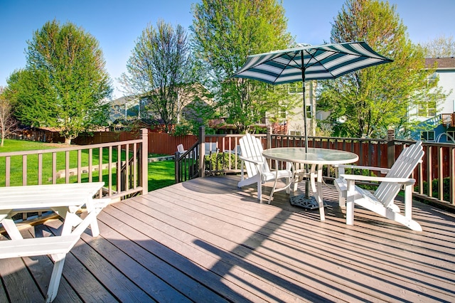 wooden deck with outdoor dining area