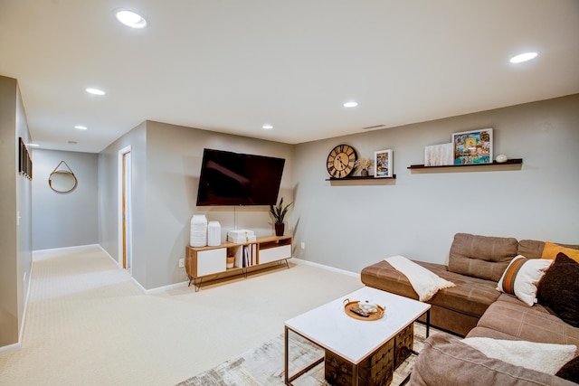 carpeted living room featuring recessed lighting and baseboards