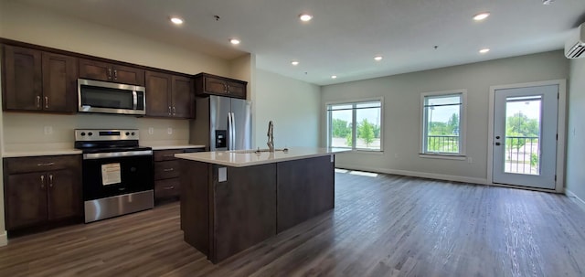 715 Lake Shore Dr NE Unit 108, Bemidji, MN 56601 - kitchen with stainless steel appliances, a sink, dark wood-style flooring, dark brown cabinetry, and recessed lighting