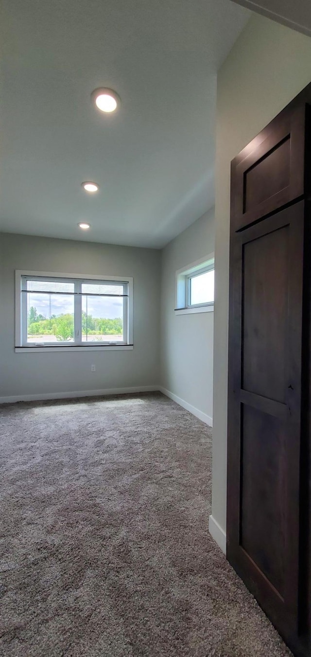 715 Lake Shore Dr NE Unit 108, Bemidji, MN 56601 - unfurnished room featuring carpet flooring, baseboards, and recessed lighting