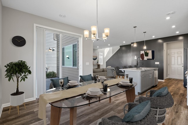 living room with dark wood-style floors, recessed lighting, baseboards, and a chandelier