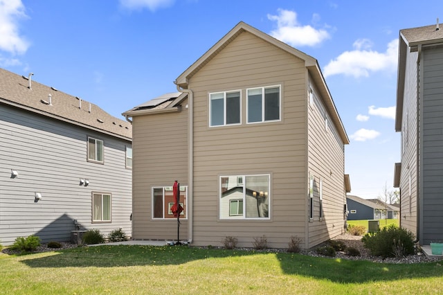 back of property with a yard