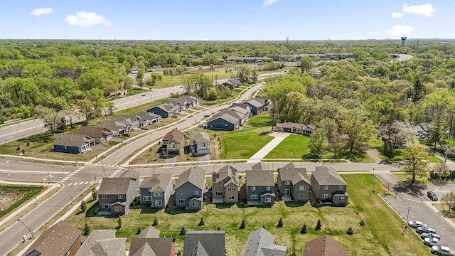 aerial view of property and surrounding area featuring nearby suburban area